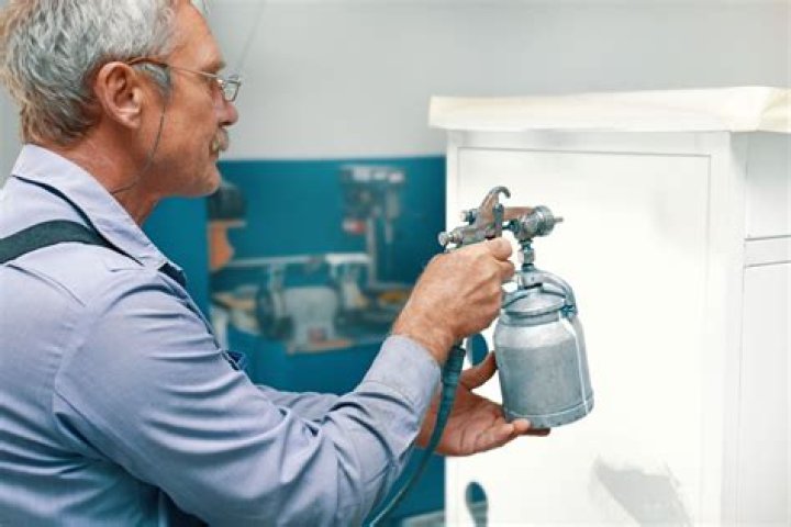 What do professionals use to paint cabinets?